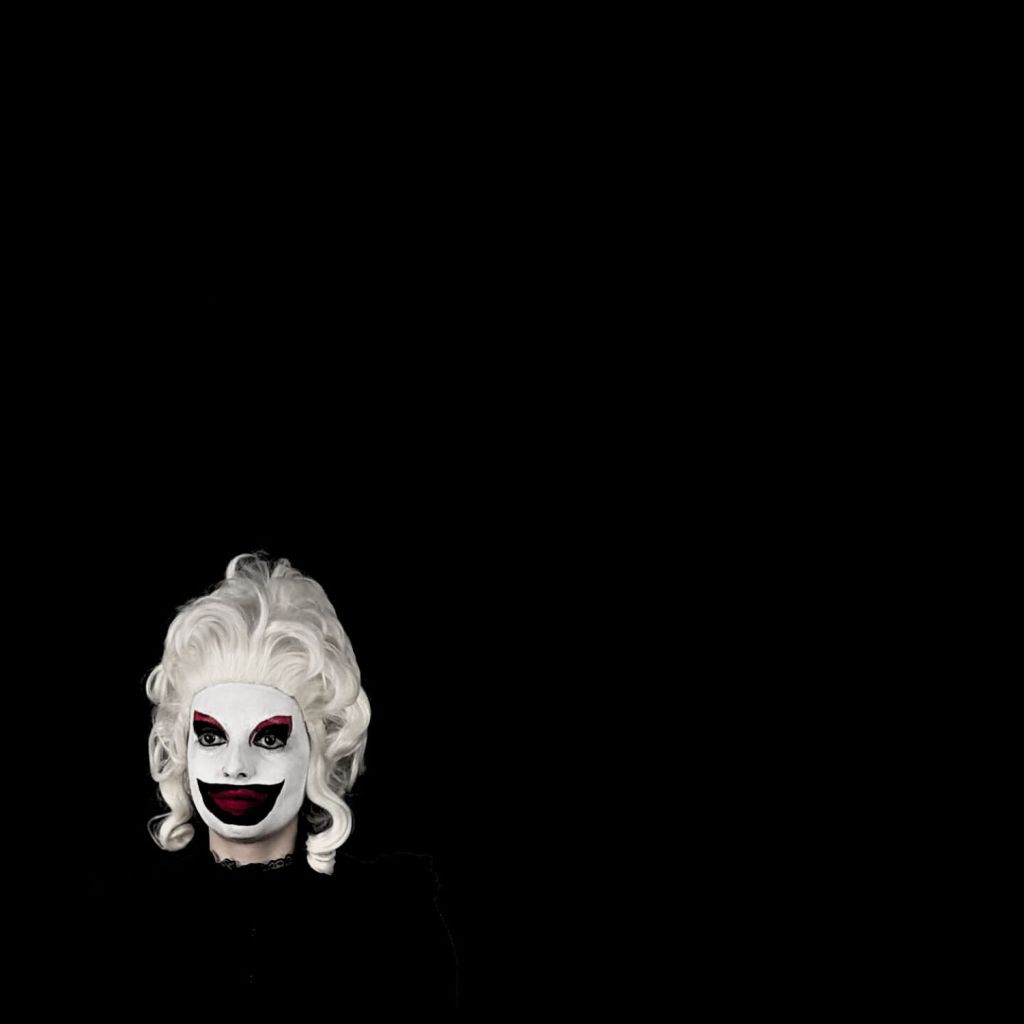 Lira Lavix in the bottom left coner of the screen surrounded by a black background